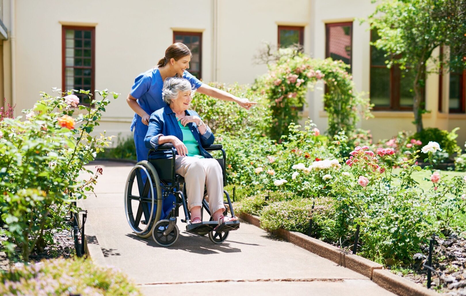 Care home worker and elderly woman