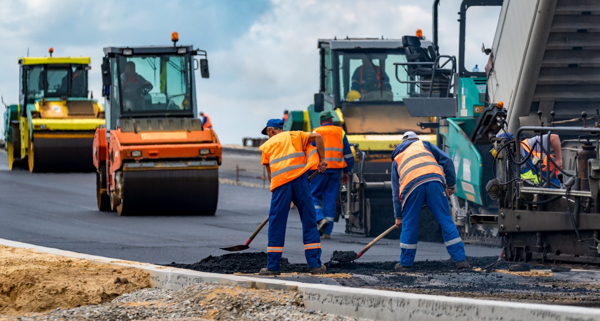 Workers and Asphalting Machines